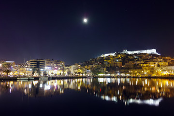 Fototapeta na wymiar Moon over Old Town of Kavala in the night, East Macedonia and Thrace, Greece