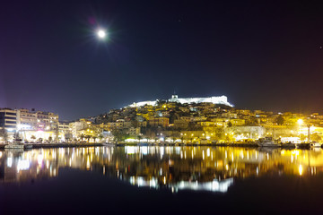 Amazing night photo of Kavala and moon over old town,  East Macedonia and Thrace, Greece