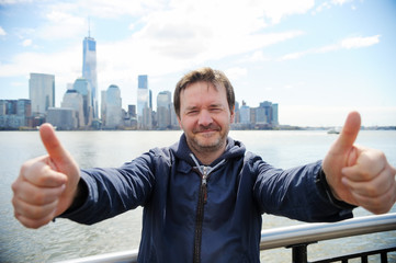 Happy man giving thumbs up sign