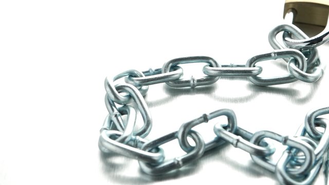 Closeup on silver chain on metal finish background.