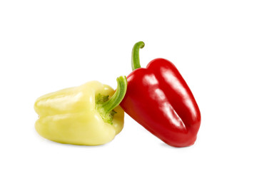 Red and yellow sweet peppers isolated on white background