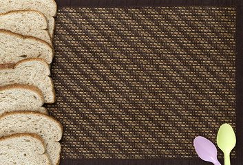 Bamboo tablecloth, bread, spoons