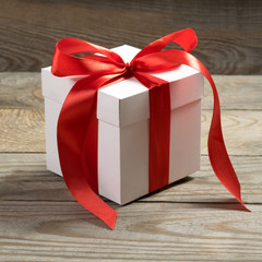 White gift box on wooden background