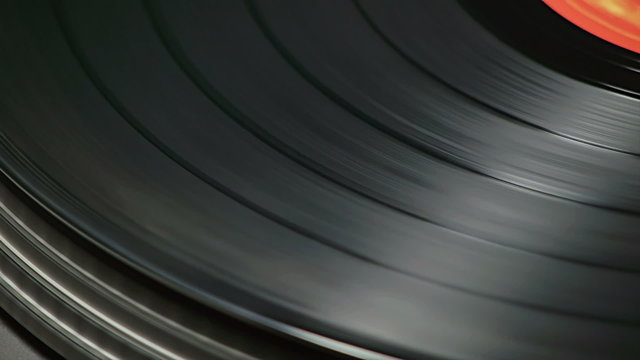 Rotating LP Vinyl Disc Seen Close up on turntable.