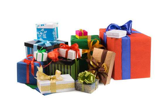 Colorful gift boxes with colored ribbons and wrapping paper on w