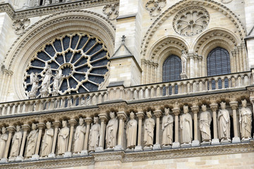 Close up of artwork and carvings in the Notre Dame Cathedral, situated along the Seine River in Paris, France