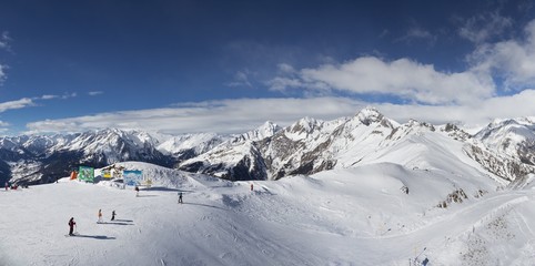 Snowy mountain top ski resort panorama