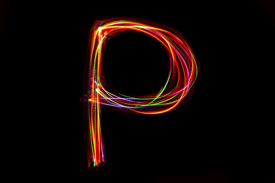 Word writing from light on the black background. - Powered by Adobe