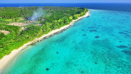 Naklejka na ściany i meble Shoreline of a tropical island in the Maldives and view of the I