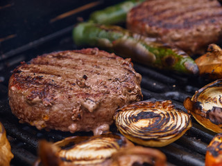 Grilling homemade hamburgers on a grill BBQ