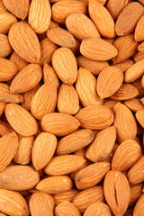 Almond nuts background closeup ..Selective focus photograph.