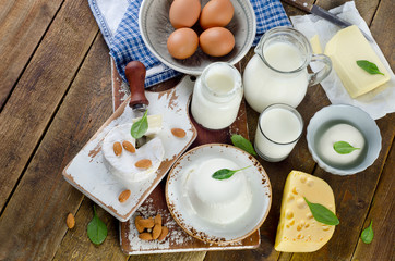 Healthy dairy products on rustic wooden background.