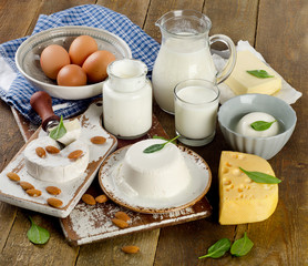 Tasty healthy dairy products on a rustic wooden table.