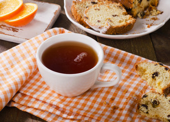 Cup of hot tea with sweet dessert.