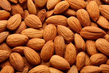 Organic almond or badam nuts background,.Selective focus photograph.