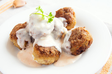 Meatballs with white creamy sauce