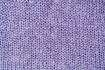 Lilac color wool knitted background closeup