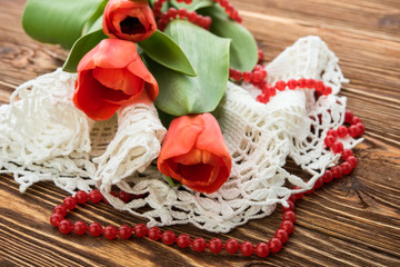 red tulips on wooden background