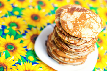 High stack of pancakes . Breakfast for the whole family .