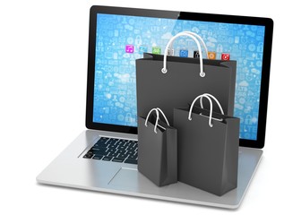 laptop and  shopping pags on white background