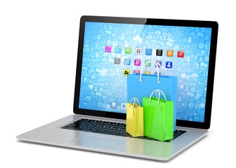 laptop and  shopping pags on white background