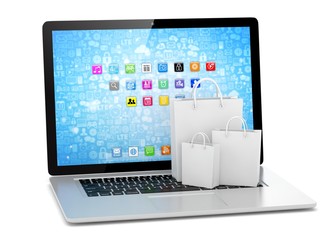 laptop and  shopping pags on white background