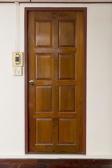 Old grunge brown wood door with wood frame and wall