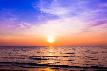 Naklejka na ściany i meble sunset and beach. Beautiful sunset above the sea