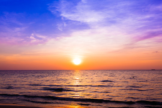 sunset and beach. Beautiful sunset above the sea © EwaStudio