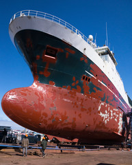 Large ship in dry dock for repairs and painting