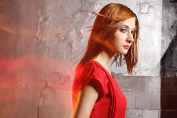 Obraz premium The beautiful natural young smiling woman of the brunette carrying a red dress. The magnificent Cosmetics of fashion, long eyelashes, fine face care of skin does-up.holiday, make, are closed