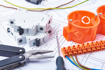 Components for use in electrical installations. Cut pliers, connectors, screwdriver, fuses and wires. Accessories for engineering work, energy concept.