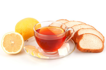 Glass cup of tea with slices white bread
