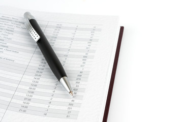 Black ballpoint pen on a page calendar.