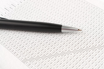 Ballpoint pen on the background of a digital table