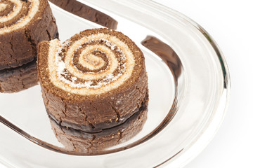 Several Swiss roll on the metal tray