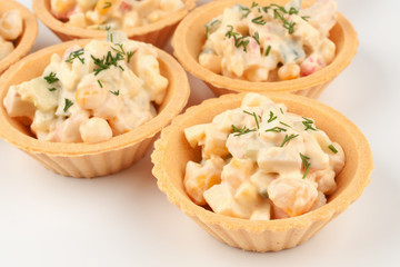Three tartlets with salad