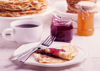 Carnival. Tea with pancakes and jam.