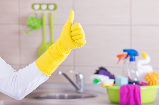 House cleaner showing ok sign