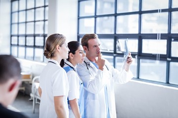 Medical team looking at x-ray together