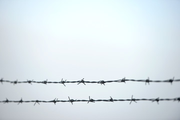 Double horizontal barb wire fence