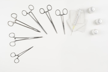 Top view of modern, sterile doctors office desk. Medical accessories on a white background with copy space around products. Photo taken from above.