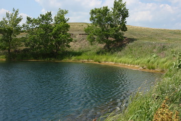 Healing hydrogen sulphide lake against a blue sky