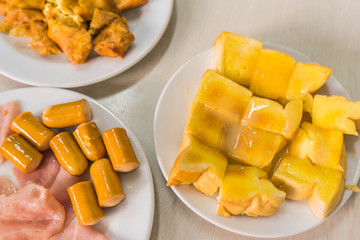 ham and sausage ,sweetened condensed milk and butter bread toast