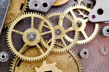 Vintage clock mechanism with gears. Cog wheels.