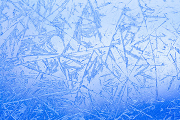 Frozen glass. Ice flowers. Frost flowers. Window frost. Winter in the window. Frozen window. Macro....