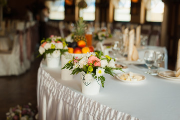 Image of holy family and candle on wedding table