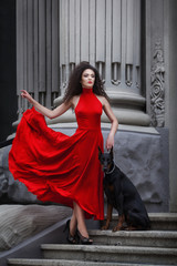 Young beautiful caucasian brunette posing over city background