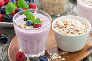 berry smoothie with oatmeal in a glass, close-up