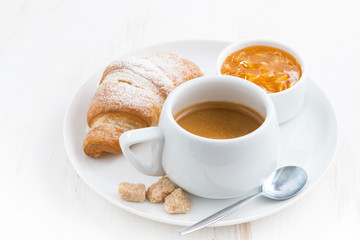 traditional breakfast with coffee and fresh croissants